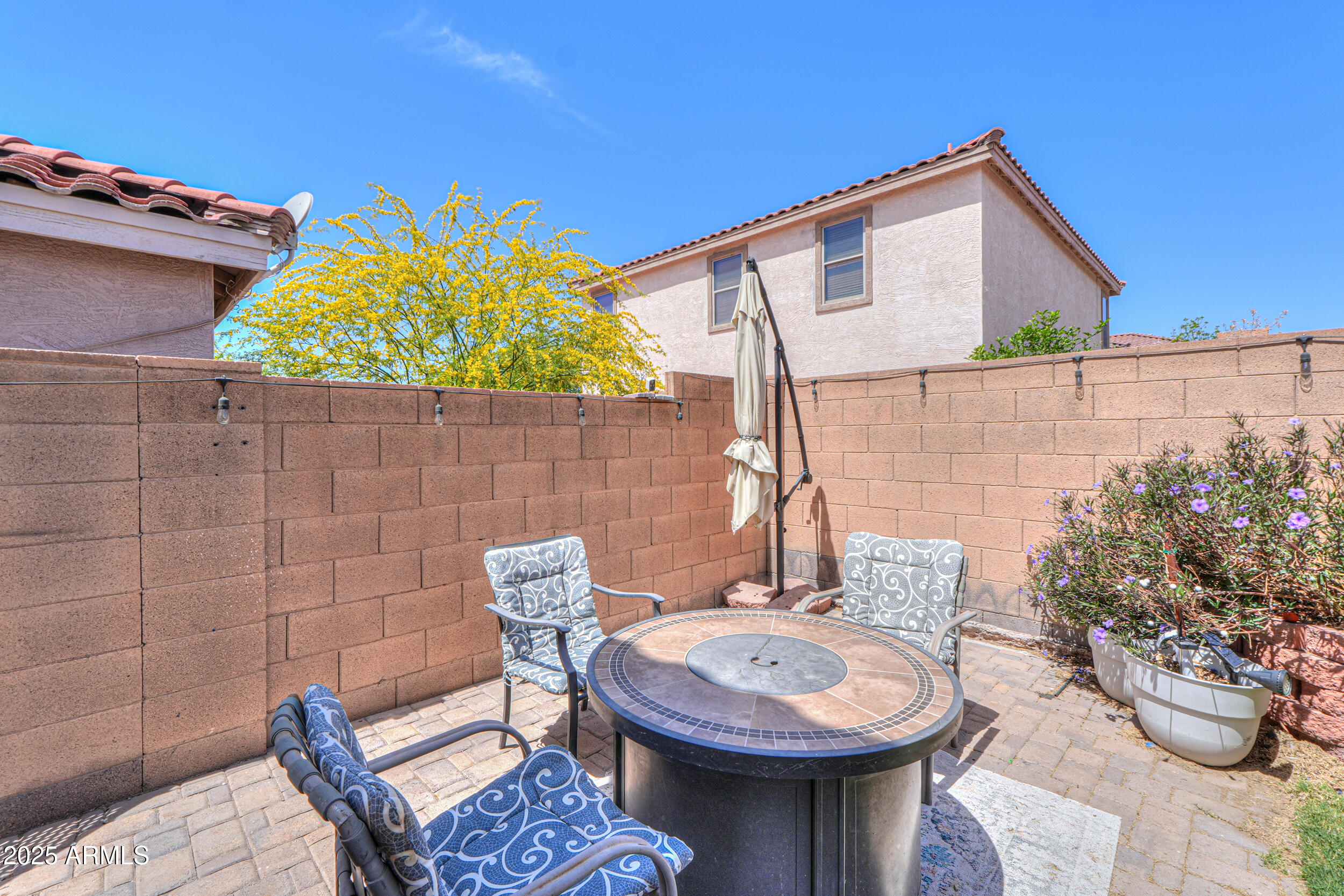 3433 South Chaparral Road Apache Junction, AZ 85119 - Photo 35 of 37 a view of a patio with table and chairs potted plants