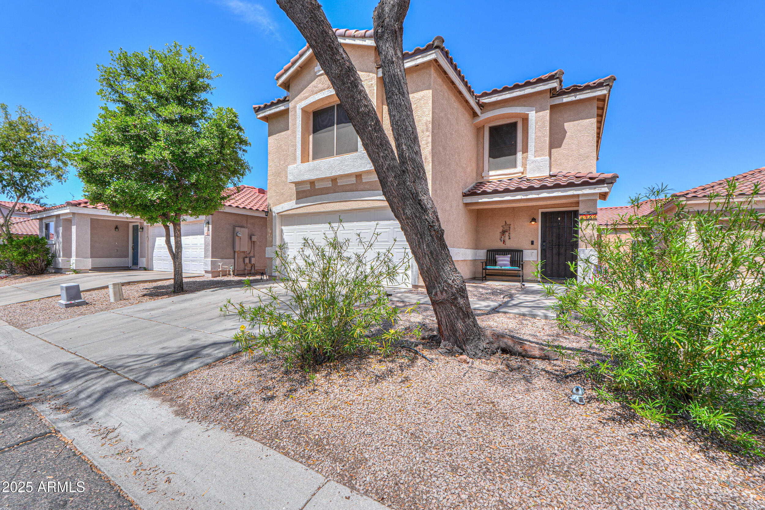 3433 South Chaparral Road Apache Junction, AZ 85119 - Photo 5 of 37 a front view of a house with garden