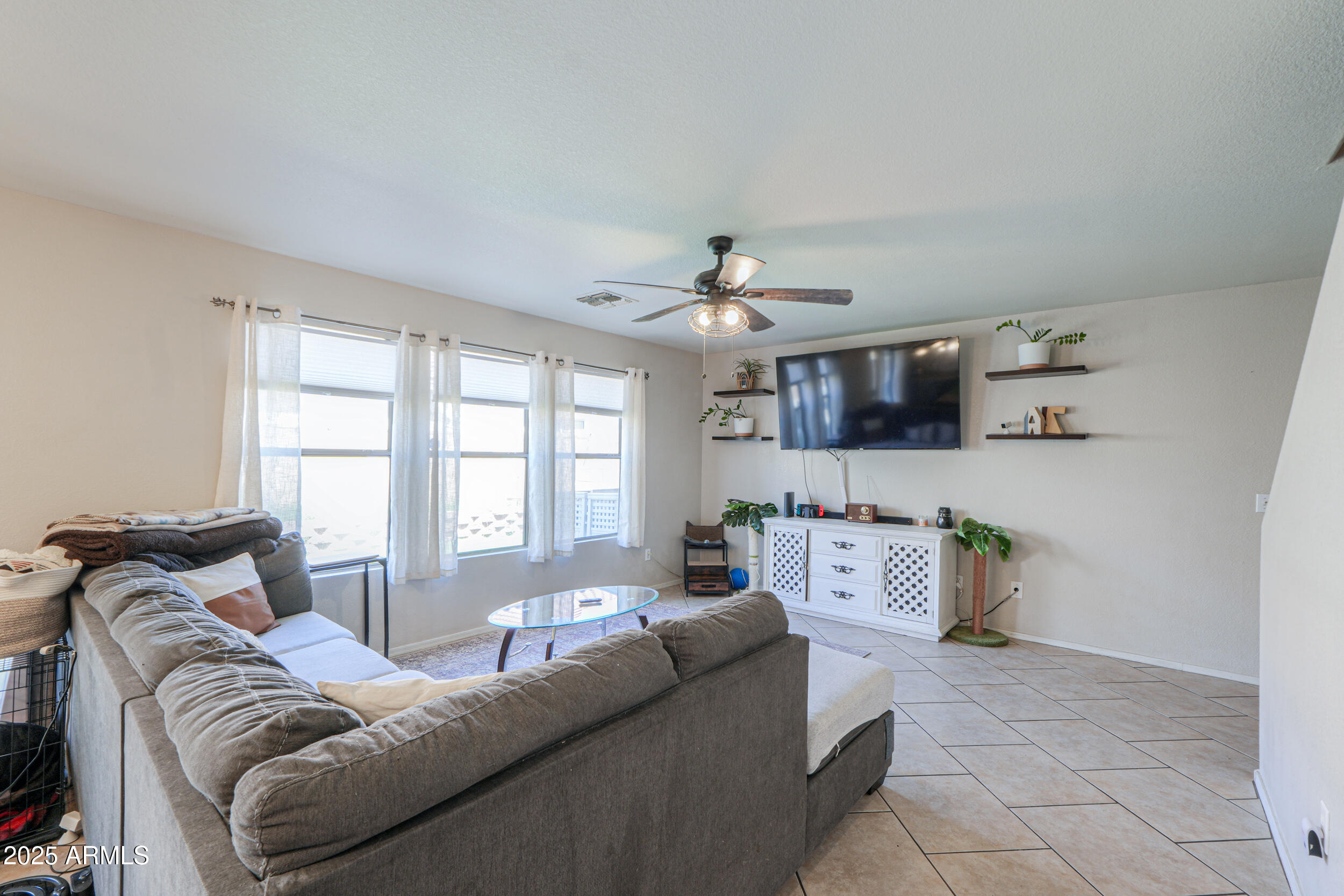 3433 South Chaparral Road Apache Junction, AZ 85119 - Photo 8 of 37 a living room with furniture and a large window