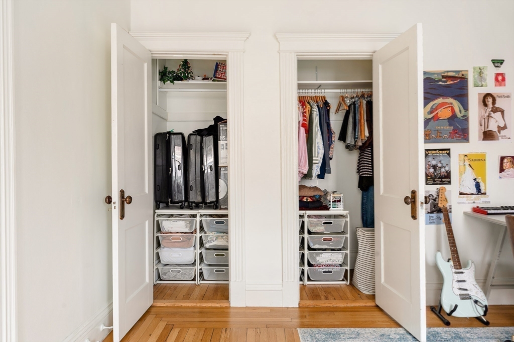 111 Jersey Street, Unit 12 Boston, MA 02215 - Photo 12 of 17 a view of walk in closet with clothes and shoes