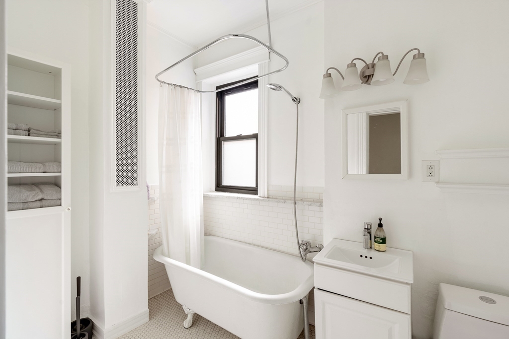 111 Jersey Street, Unit 12 Boston, MA 02215 - Photo 15 of 17 a bathroom with a sink a toilet and shower
