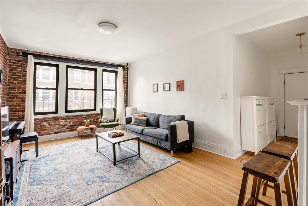 111 Jersey Street, Unit 12 Boston, MA 02215 - Photo 3 of 17 a living room with furniture and a window