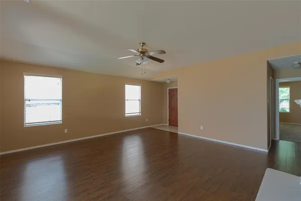 a large kitchen with cabinets and stainless steel appliances