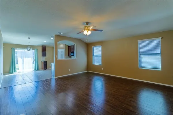 a kitchen with refrigerator and window