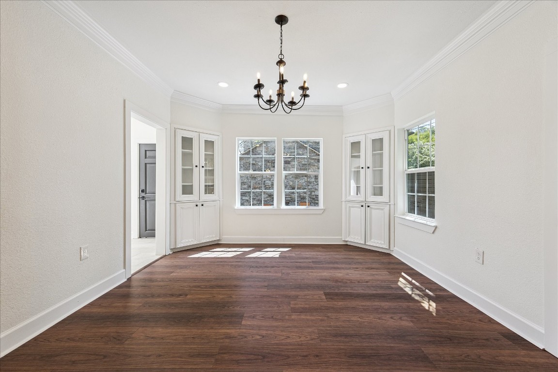 3071 Locke Lane Houston, TX 77019 - Photo 18 of 44 This inviting breakfast room features neutral designer wall paint, crown molding, and a sophisticated chandelier, with windows overlooking the backyard. Open to the kitchen and sunroom, it’s perfect for casual meals or morning coffee.
