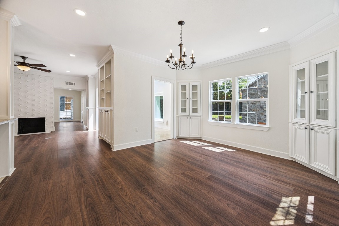3071 Locke Lane Houston, TX 77019 - Photo 20 of 44 Elegant yet comfortable, this breakfast room boasts crown molding, chandelier lighting, and neutral designer walls. Surrounded by windows facing the backyard, it provides a serene spot to enjoy meals while staying connected to the kitchen and sunroom.