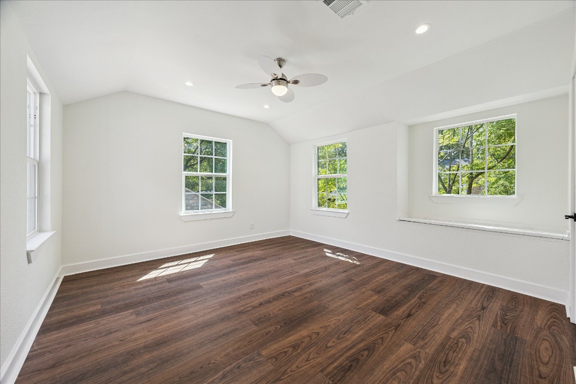 3071 Locke Lane Houston, TX 77019 - Photo 37 of 44 This guest suite features laminate flooring, a ceiling fan with light kit, and recessed lighting, creating a bright and comfortable space perfect for visitors or flexible living.