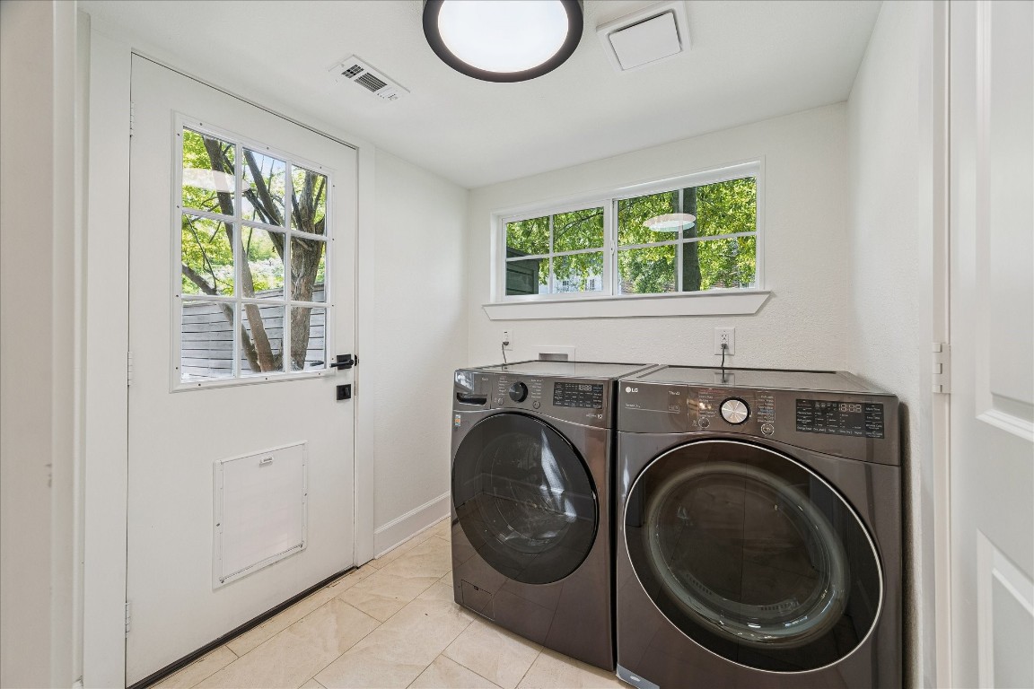 3071 Locke Lane Houston, TX 77019 - Photo 39 of 44 Functional and well-appointed, the utility room features ample storage, counter space, and convenient hookups, making laundry and household tasks effortless.