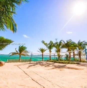 a view of ocean with palm trees