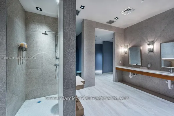 a view of a hallway with a painting on the wall