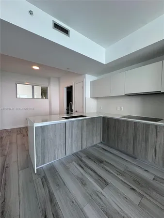 a view of kitchen with wooden floor