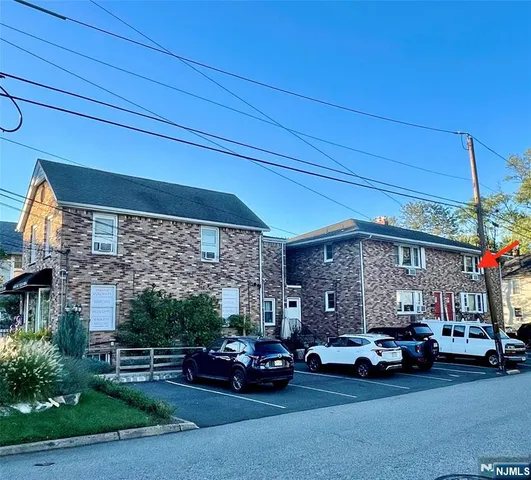 a view of car parked in front of house