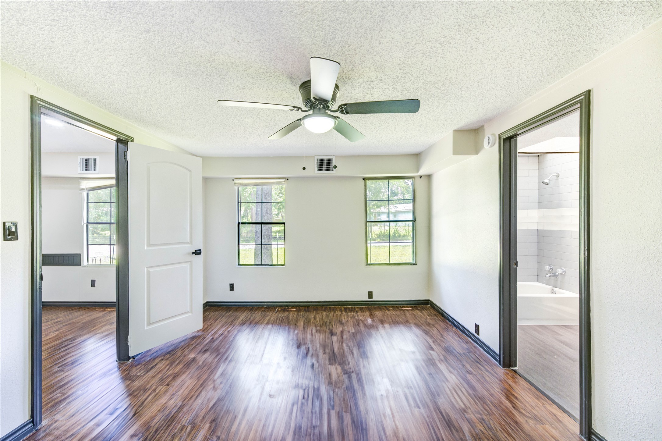 26342 Hunters Trail New Caney, TX 77357 - Photo 14 of 26 a view of empty room with wooden floor and fan