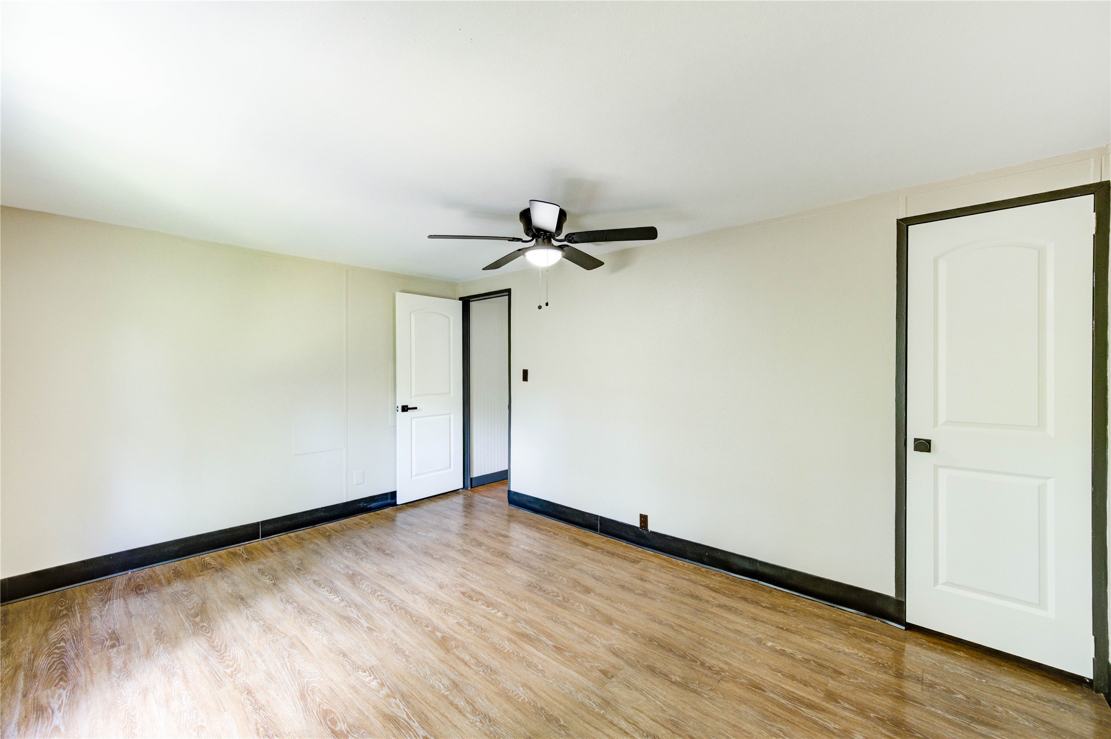 26342 Hunters Trail New Caney, TX 77357 - Photo 19 of 26 a view of empty room with wooden floor