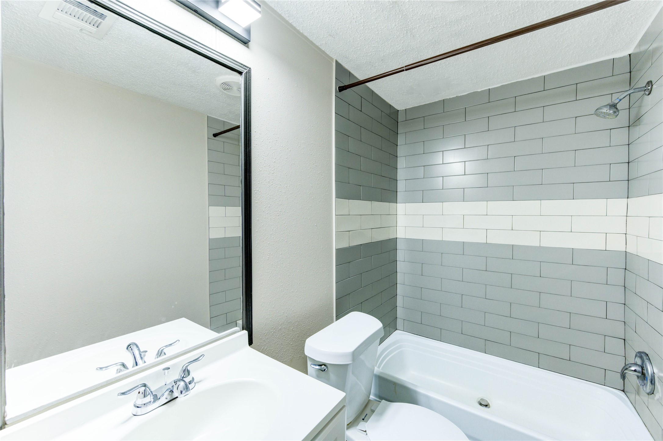26342 Hunters Trail New Caney, TX 77357 - Photo 20 of 26 a bathroom with a sink a toilet and shower