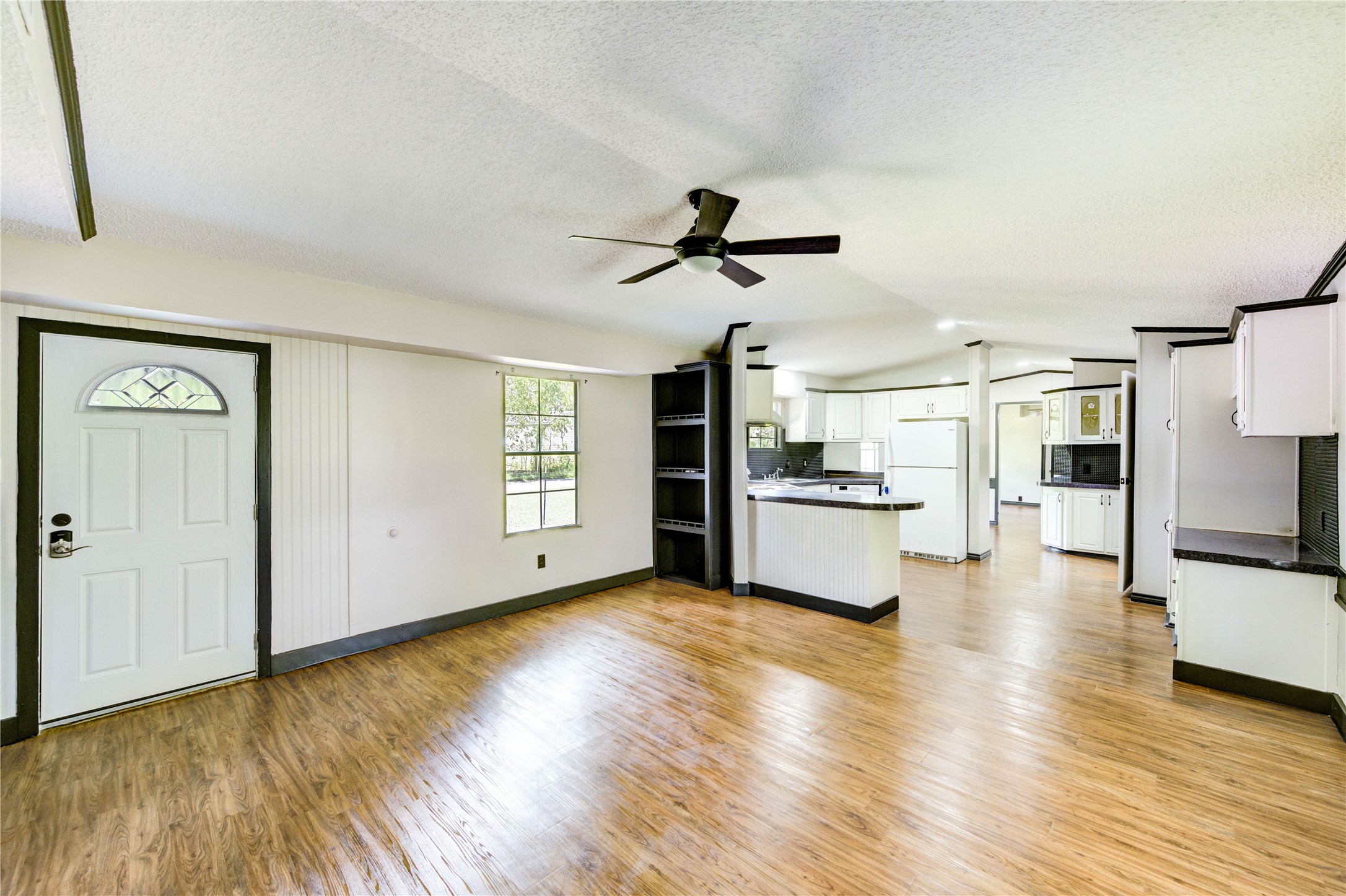26342 Hunters Trail New Caney, TX 77357 - Photo 2 of 26 a view of a kitchen with microwave and stove