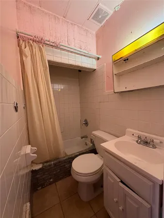 a bathroom with a toilet and a sink