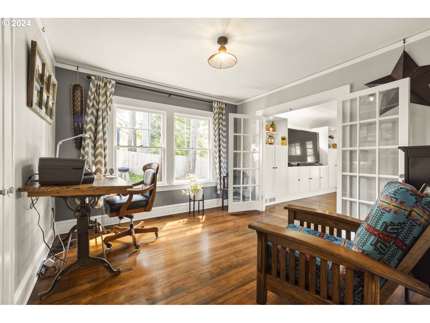 3029 Southwest Sunset Boulevard Portland, OR 97239 - Photo 12 of 48 a living room with furniture and a floor to ceiling window