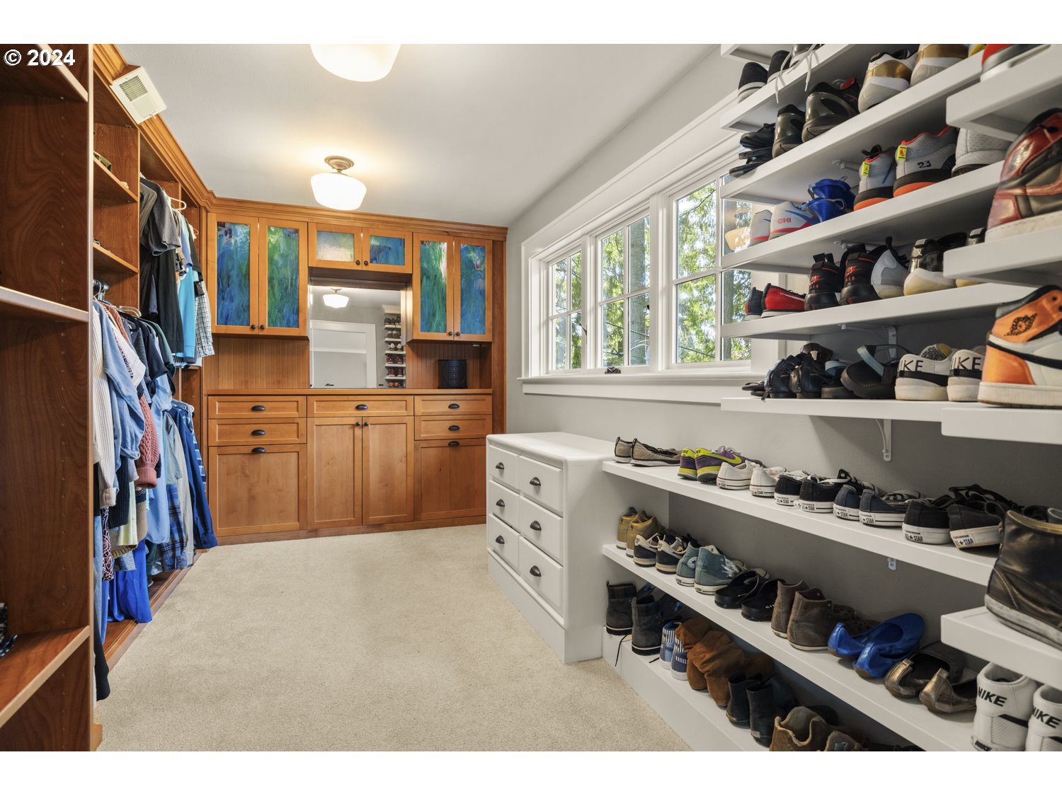 3029 Southwest Sunset Boulevard Portland, OR 97239 - Photo 15 of 48 a kitchen that has a lot of cabinets in it and a window