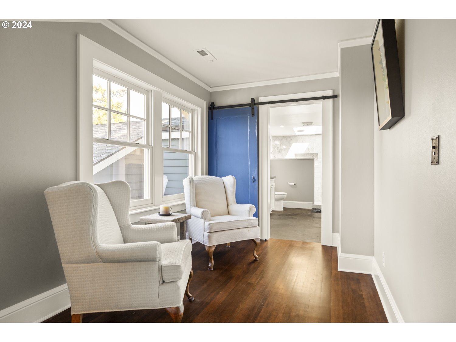 3029 Southwest Sunset Boulevard Portland, OR 97239 - Photo 16 of 48 a living room with furniture and a flat screen tv