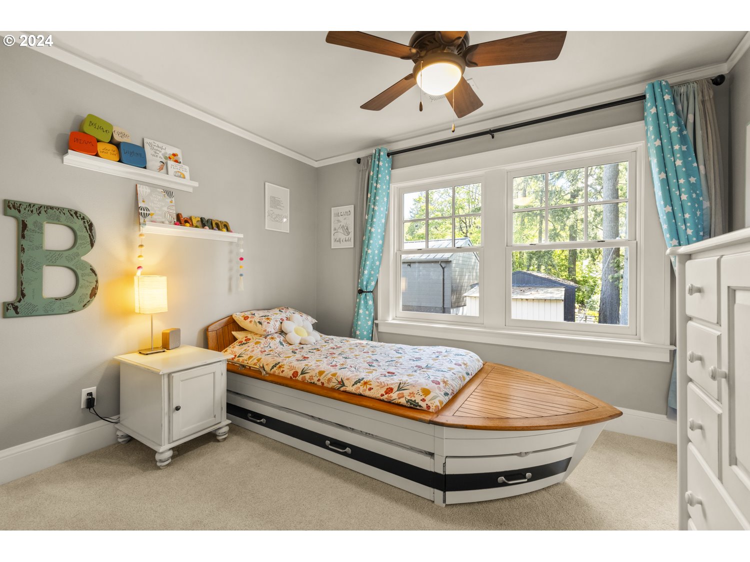 3029 Southwest Sunset Boulevard Portland, OR 97239 - Photo 19 of 48 a living room with a bed furniture and a large window