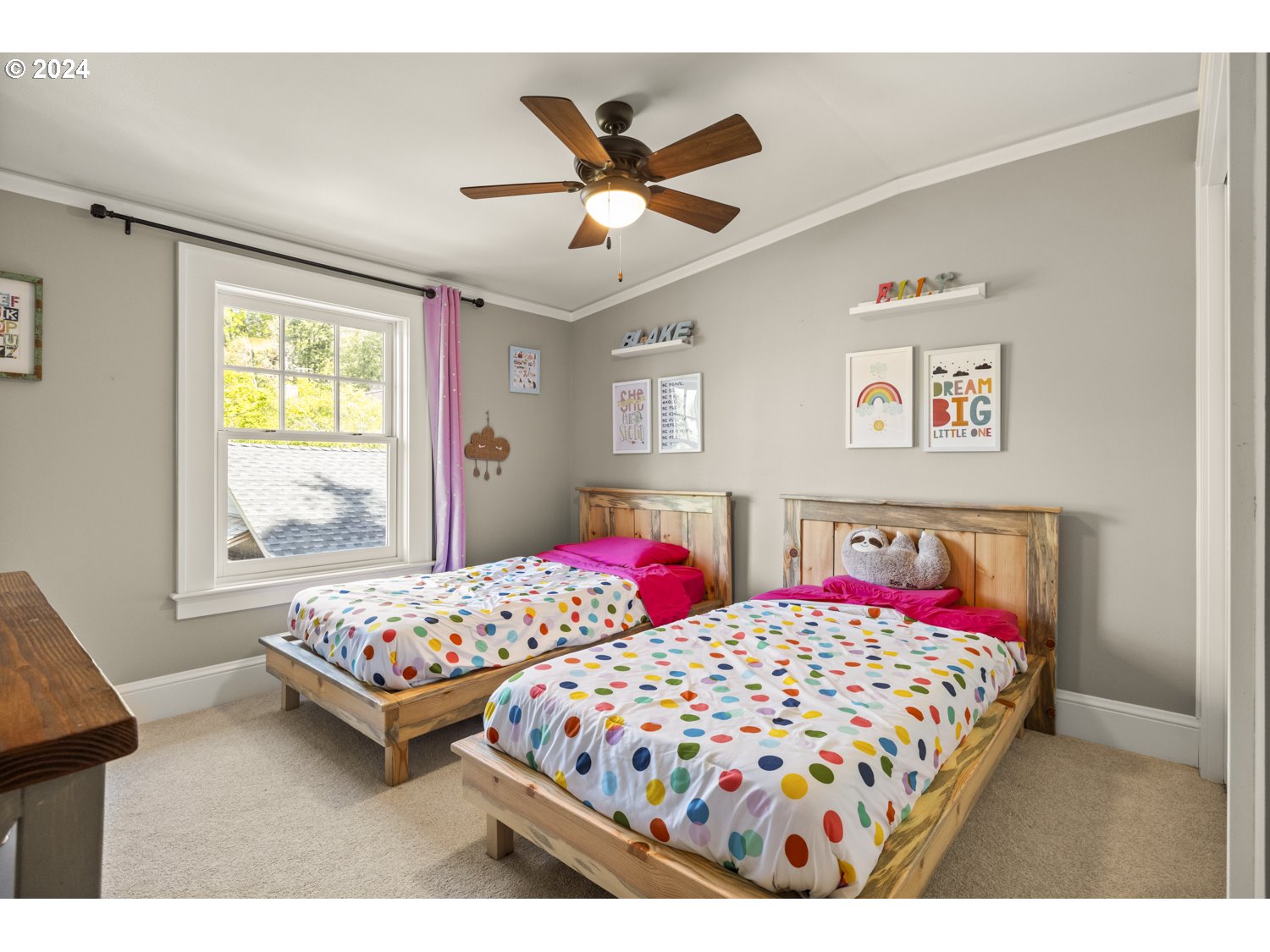 3029 Southwest Sunset Boulevard Portland, OR 97239 - Photo 21 of 48 a bedroom with two beds and a window