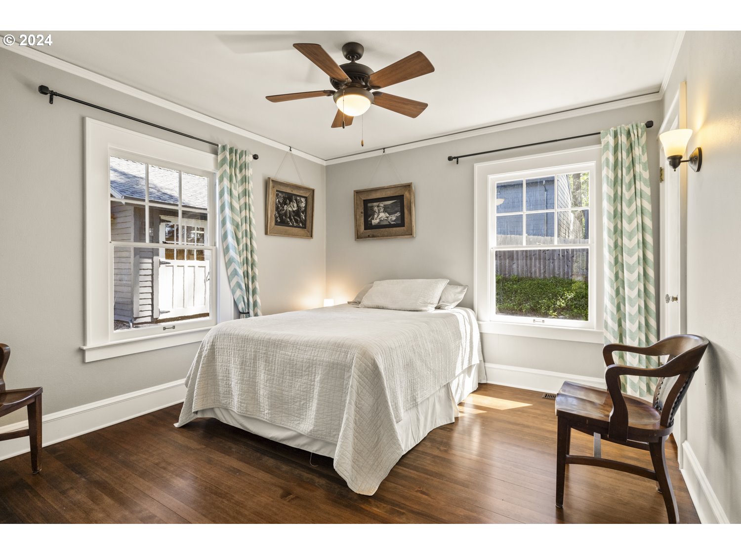 3029 Southwest Sunset Boulevard Portland, OR 97239 - Photo 23 of 48 a bedroom with a bed and a window