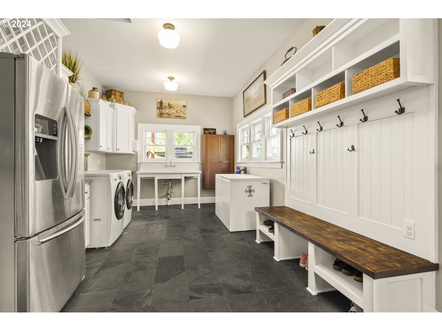 3029 Southwest Sunset Boulevard Portland, OR 97239 - Photo 27 of 48 a kitchen with stainless steel appliances a refrigerator sink and cabinets