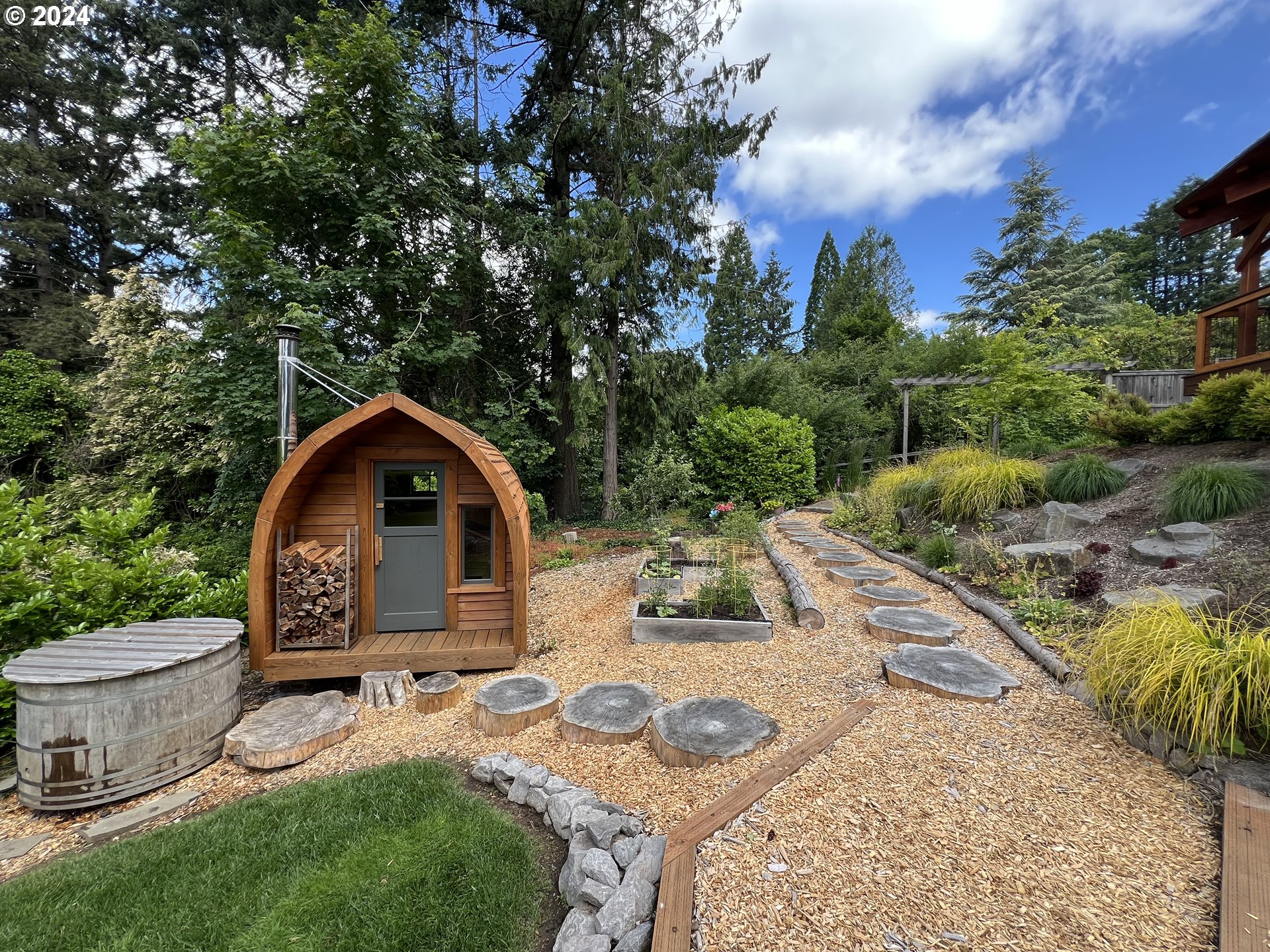 3029 Southwest Sunset Boulevard Portland, OR 97239 - Photo 32 of 48 a view of a backyard with sitting area