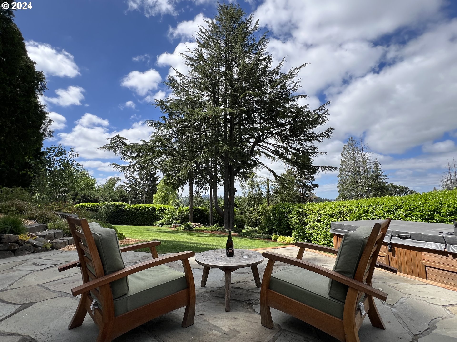 3029 Southwest Sunset Boulevard Portland, OR 97239 - Photo 40 of 48 a swimming pool with outdoor seating and trees