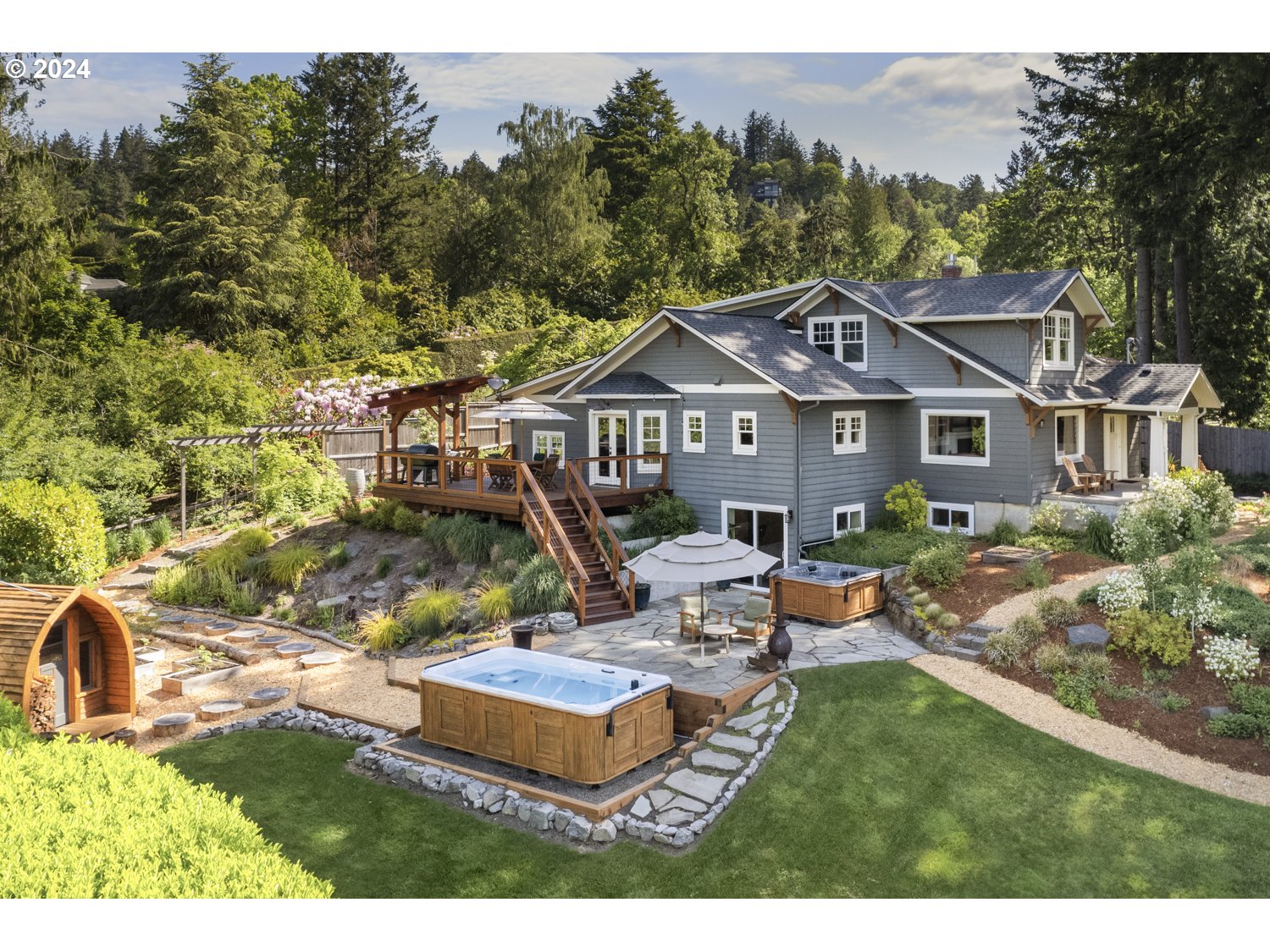 3029 Southwest Sunset Boulevard Portland, OR 97239 - Photo 4 of 48 a aerial view of a house with garden and sitting area