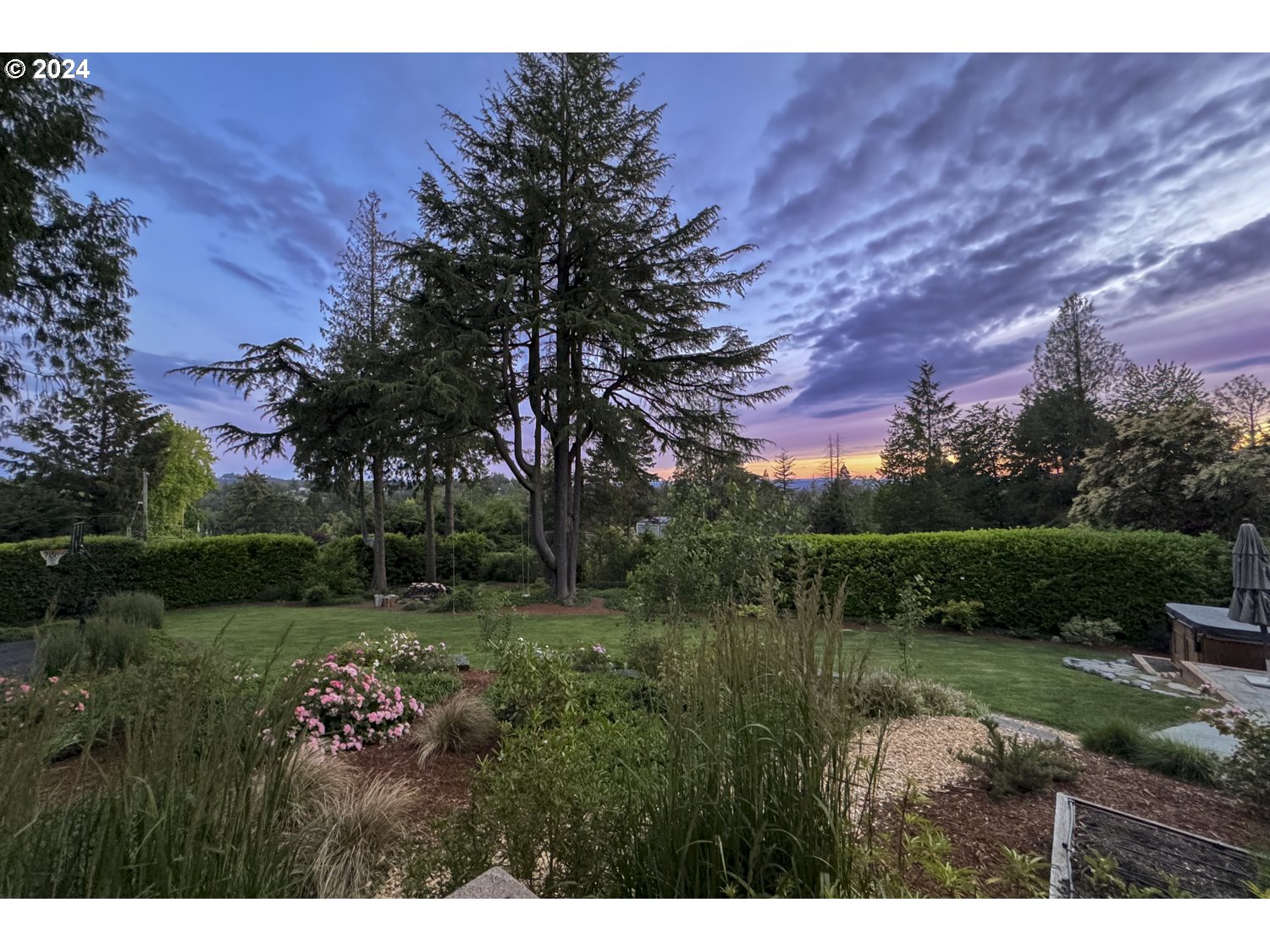 3029 Southwest Sunset Boulevard Portland, OR 97239 - Photo 44 of 48 a view of a lake with a yard and large trees