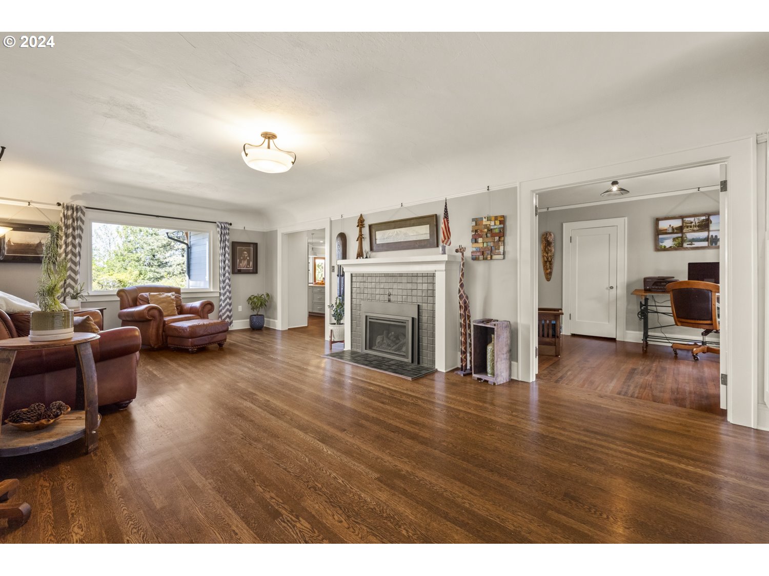 3029 Southwest Sunset Boulevard Portland, OR 97239 - Photo 7 of 48 a living room with furniture and a fireplace