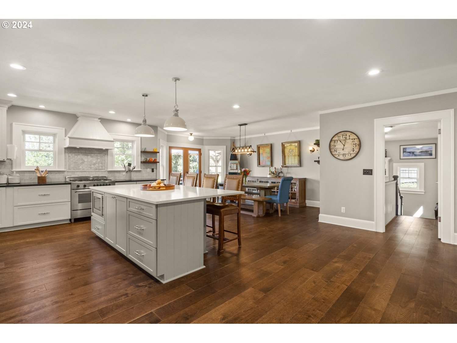 3029 Southwest Sunset Boulevard Portland, OR 97239 - Photo 8 of 48 a large white kitchen with lots of counter space a sink and appliances