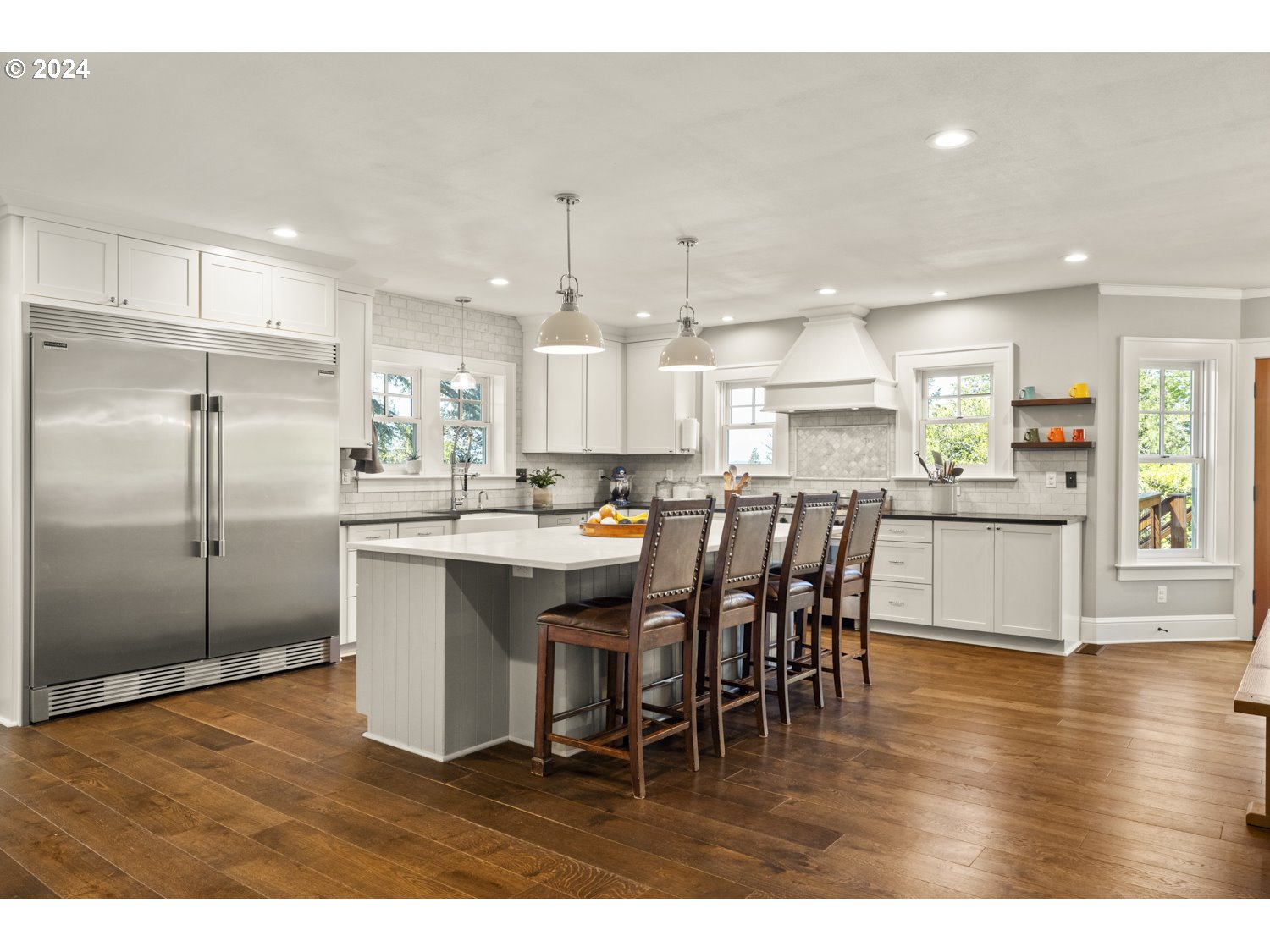 3029 Southwest Sunset Boulevard Portland, OR 97239 - Photo 10 of 48 a large kitchen with a table and chairs