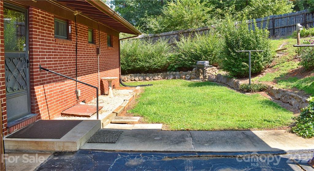 700 Mountain Creek Road Albemarle, NC 28001 - Photo 12 of 48 a view of a backyard with plants