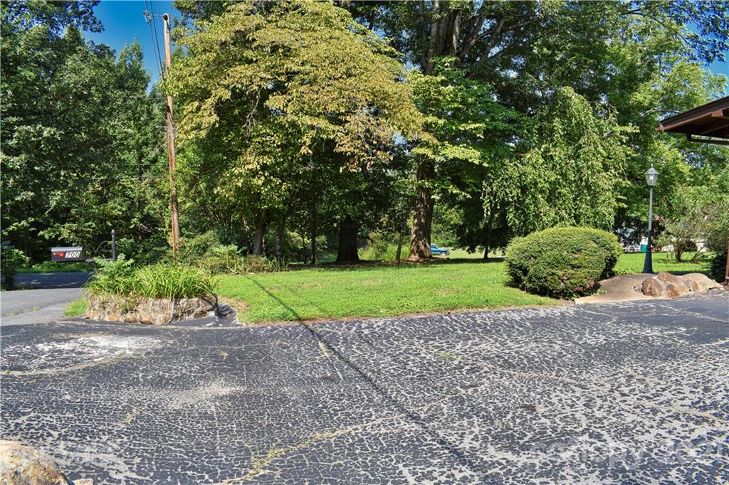 700 Mountain Creek Road Albemarle, NC 28001 - Photo 15 of 48 a view of a house with a yard