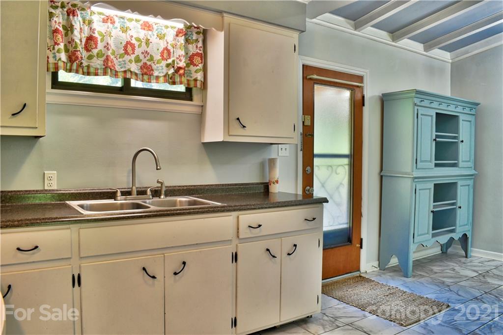 700 Mountain Creek Road Albemarle, NC 28001 - Photo 25 of 48 a kitchen with stainless steel appliances granite countertop white cabinets and a sink