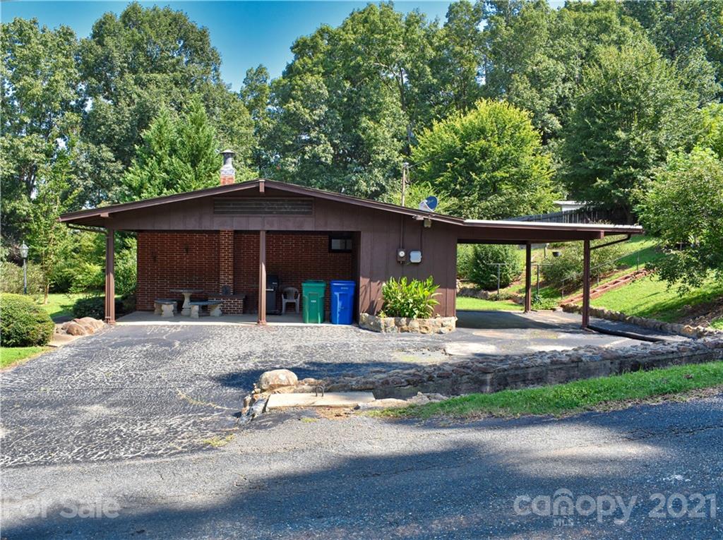 700 Mountain Creek Road Albemarle, NC 28001 - Photo 4 of 48 a front view of a house with a yard and trees around