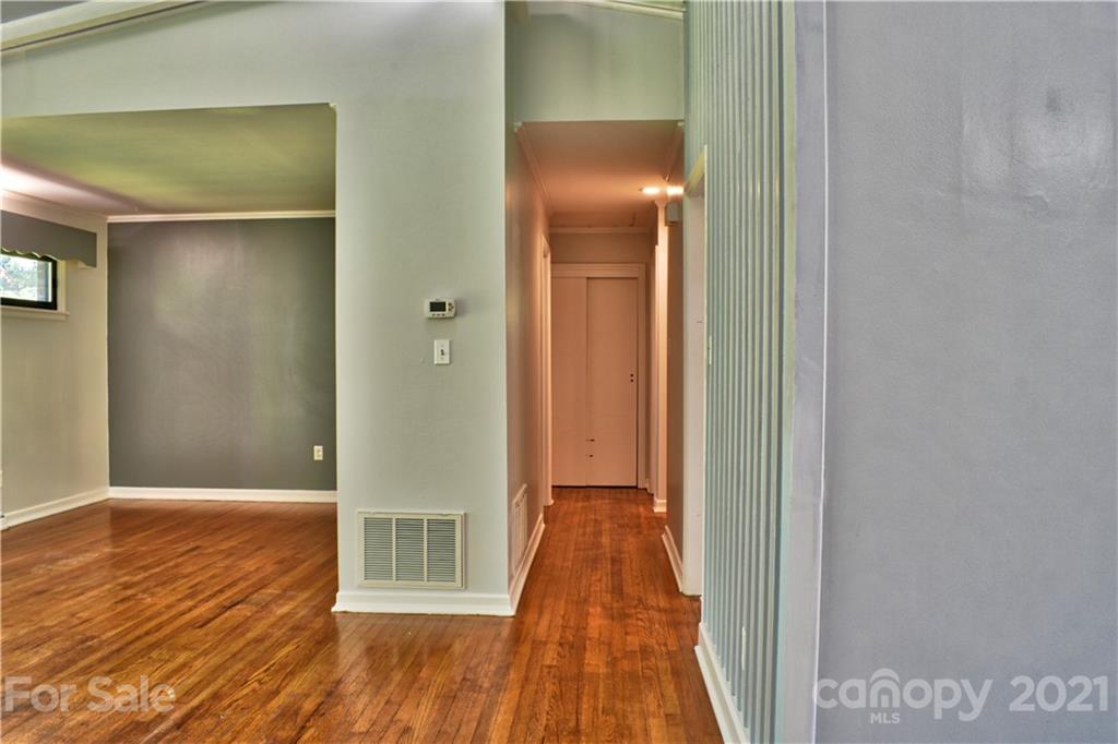 700 Mountain Creek Road Albemarle, NC 28001 - Photo 31 of 48 a view of a hallway with wooden floor