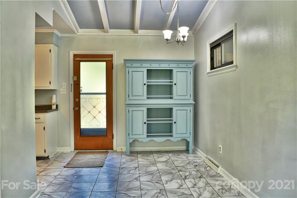 700 Mountain Creek Road Albemarle, NC 28001 - Photo 32 of 48 a view of a hallway with a door and a fireplace