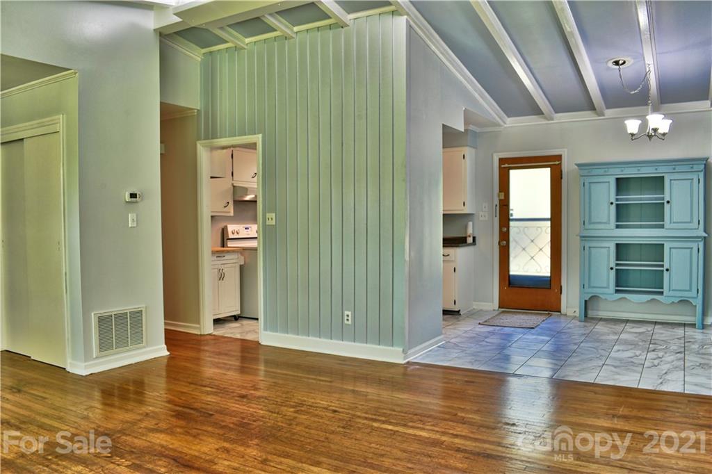 700 Mountain Creek Road Albemarle, NC 28001 - Photo 34 of 48 an empty room with wooden floor and windows
