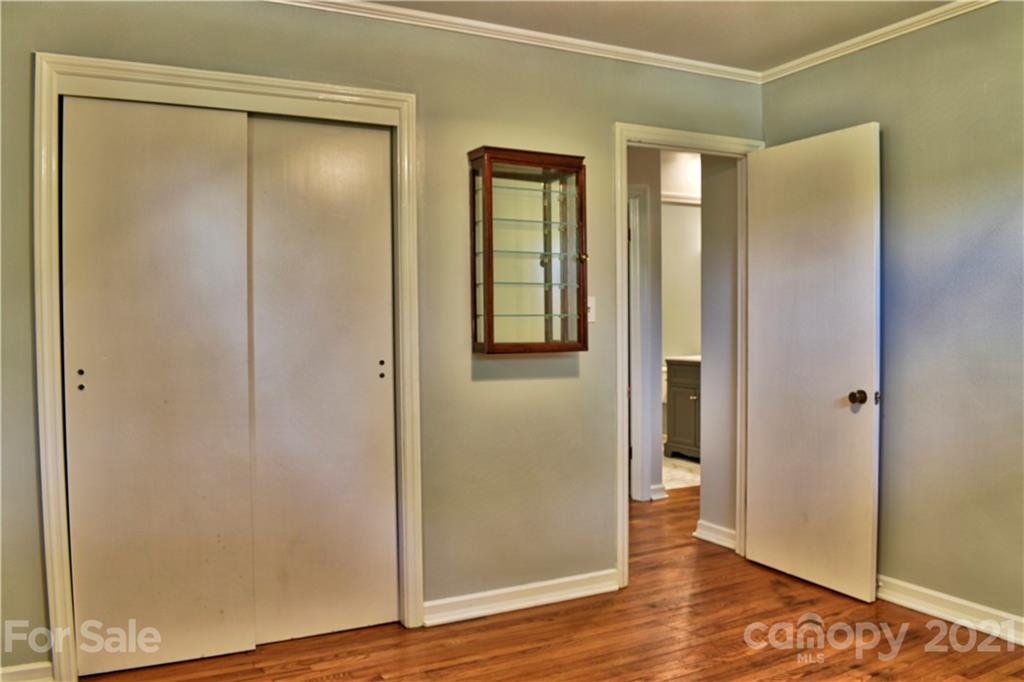 700 Mountain Creek Road Albemarle, NC 28001 - Photo 42 of 48 an empty room with wooden floor and closet