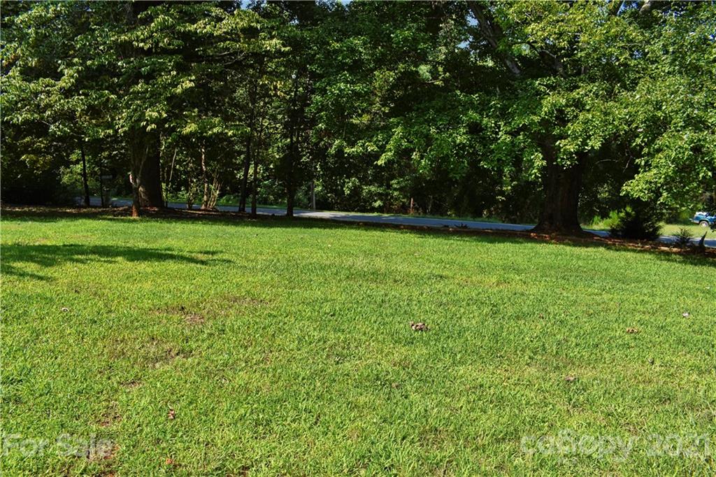 700 Mountain Creek Road Albemarle, NC 28001 - Photo 46 of 48 a view of a field of grass and trees