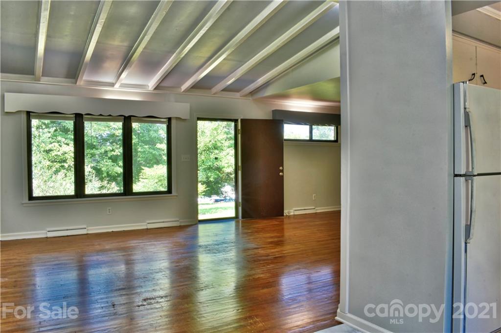 700 Mountain Creek Road Albemarle, NC 28001 - Photo 6 of 48 a view of an empty room with wooden floor and a window
