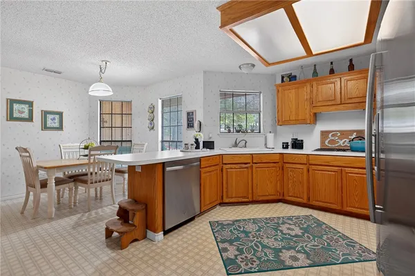 a large kitchen with a large window