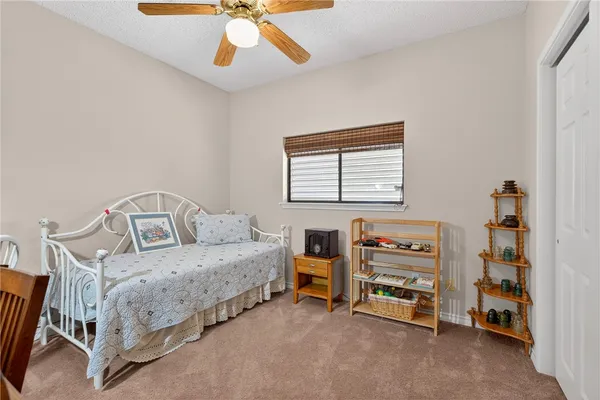a bedroom with furniture and a window