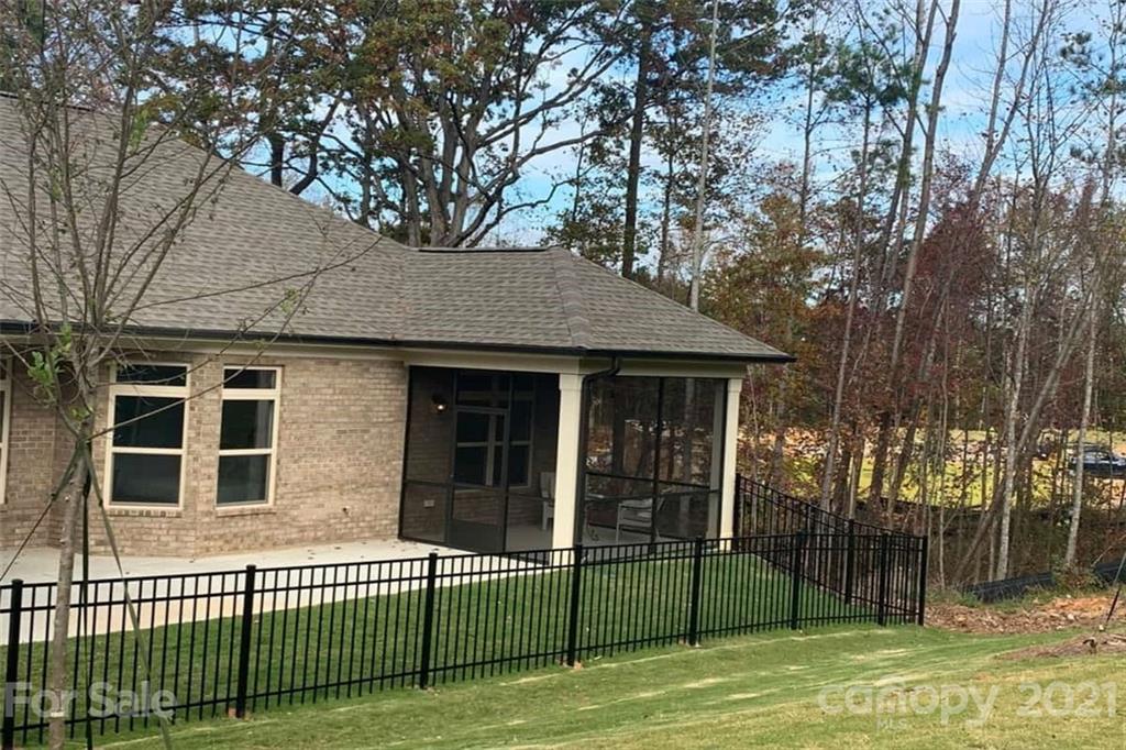 2070 New Style Way, Unit 39 Tega Cay, SC 29708 - Photo 12 of 12 a view of a house with a backyard