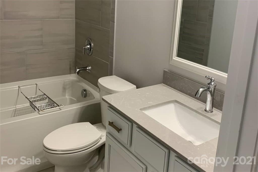 2070 New Style Way, Unit 39 Tega Cay, SC 29708 - Photo 8 of 12 a bathroom with a sink and a toilet