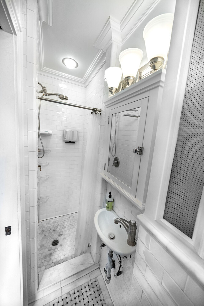 236 East 78th Street, Unit 4B Manhattan, NY 10075 - Photo 5 of 11 a bathroom with a shower a toilet and a sink